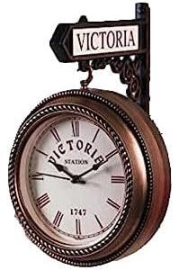 Victorian-style gold and black double-sided wall clock with intricate frame and Roman numerals.