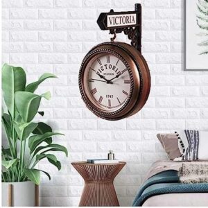 Victorian-style gold and black double-sided wall clock with intricate frame and Roman numerals.