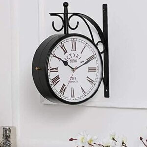 Vintage double-sided black railway wall clock with Roman numerals and wrought iron frame.