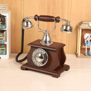 Antique brass rotary telephone on mahogany base - vintage decor collectible