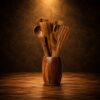 Handcrafted wooden kitchen utensil set with spoon spatula and holder on rustic wooden background